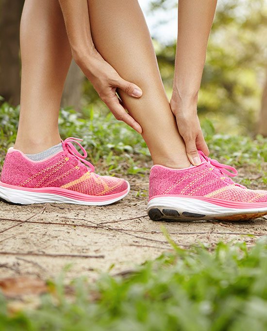 Runner holding a sprained ankle