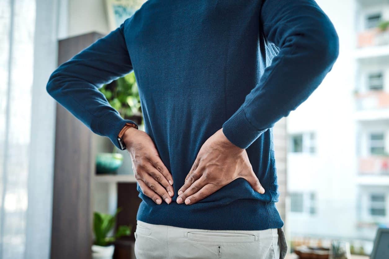 Man holding his lower back in pain