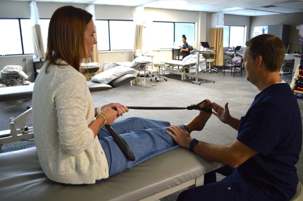 Patient enduring foot and ankle conditioning physical therapy