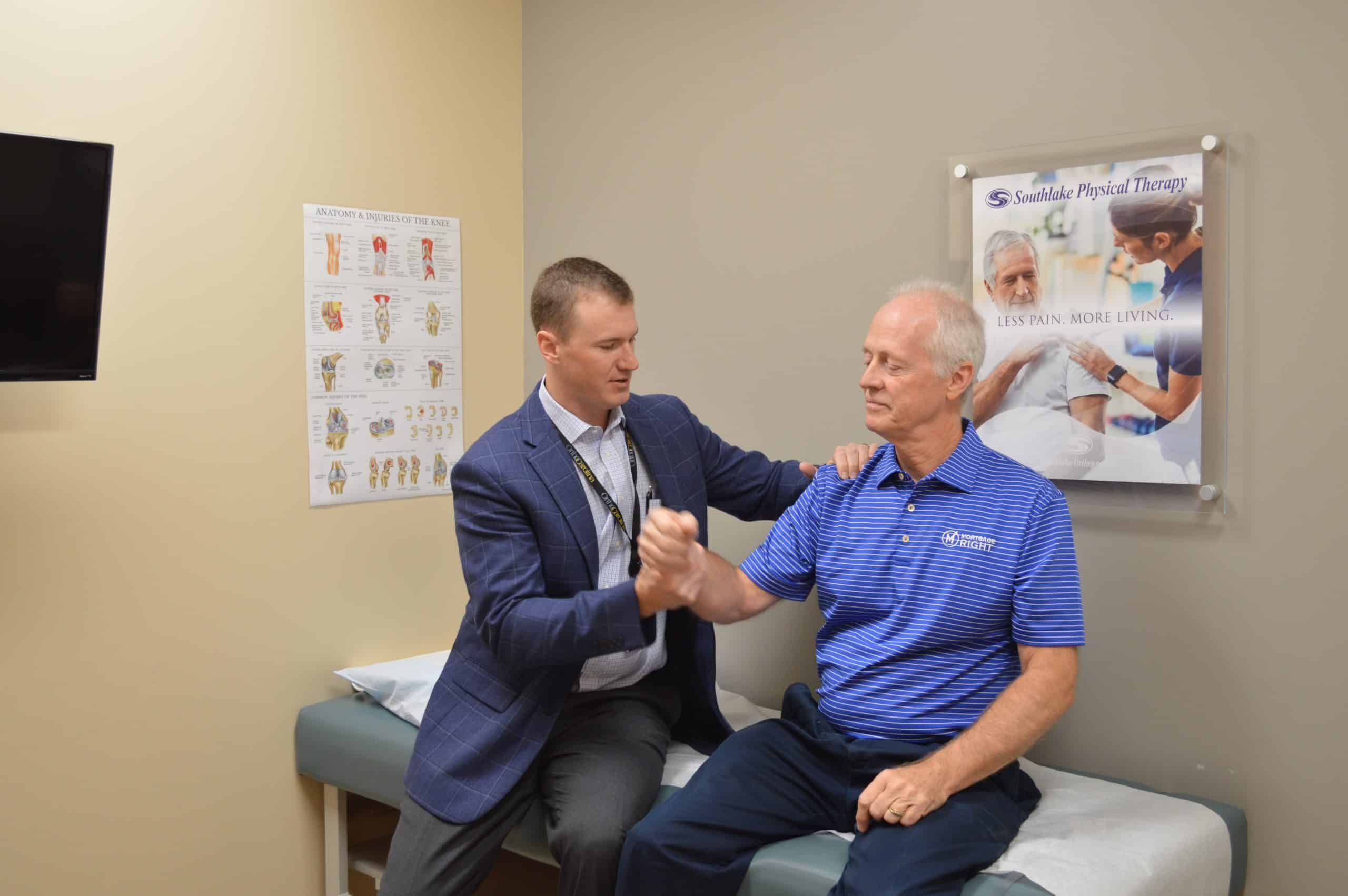 Dr. Isbell evaluating patient with shoulder arthritis