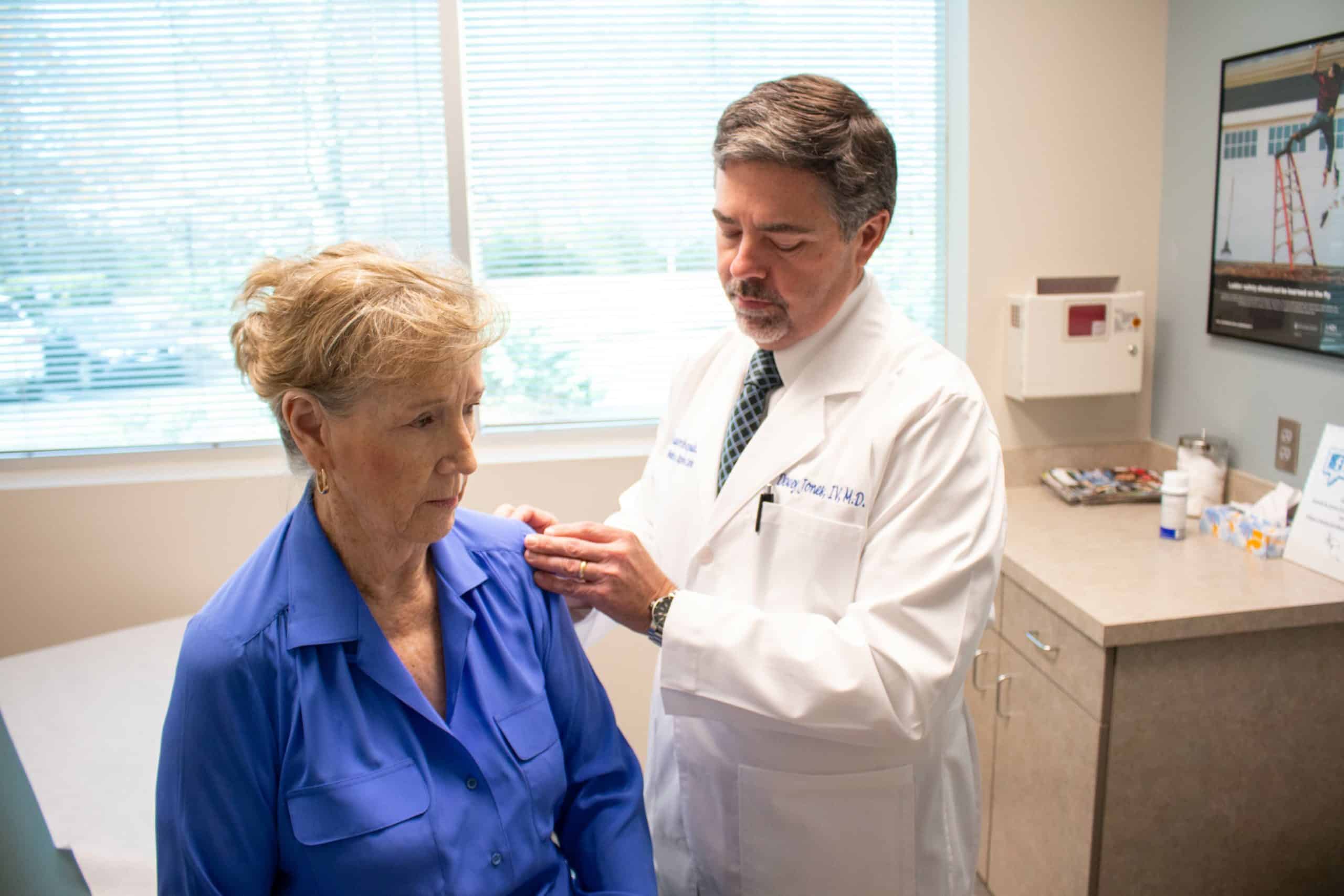 Dr. Jones diagnosing patient with shoulder arthritis