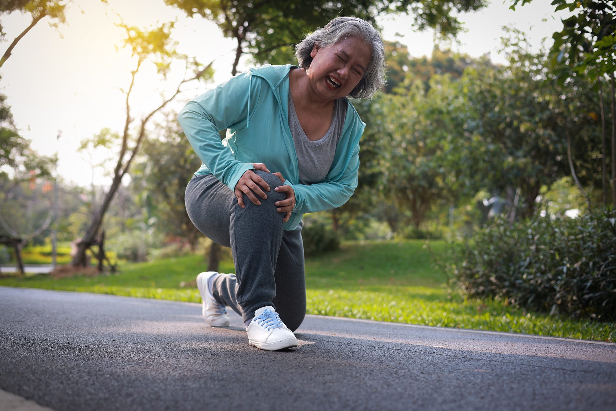 Patient experiencing muscle sprain during a jog
