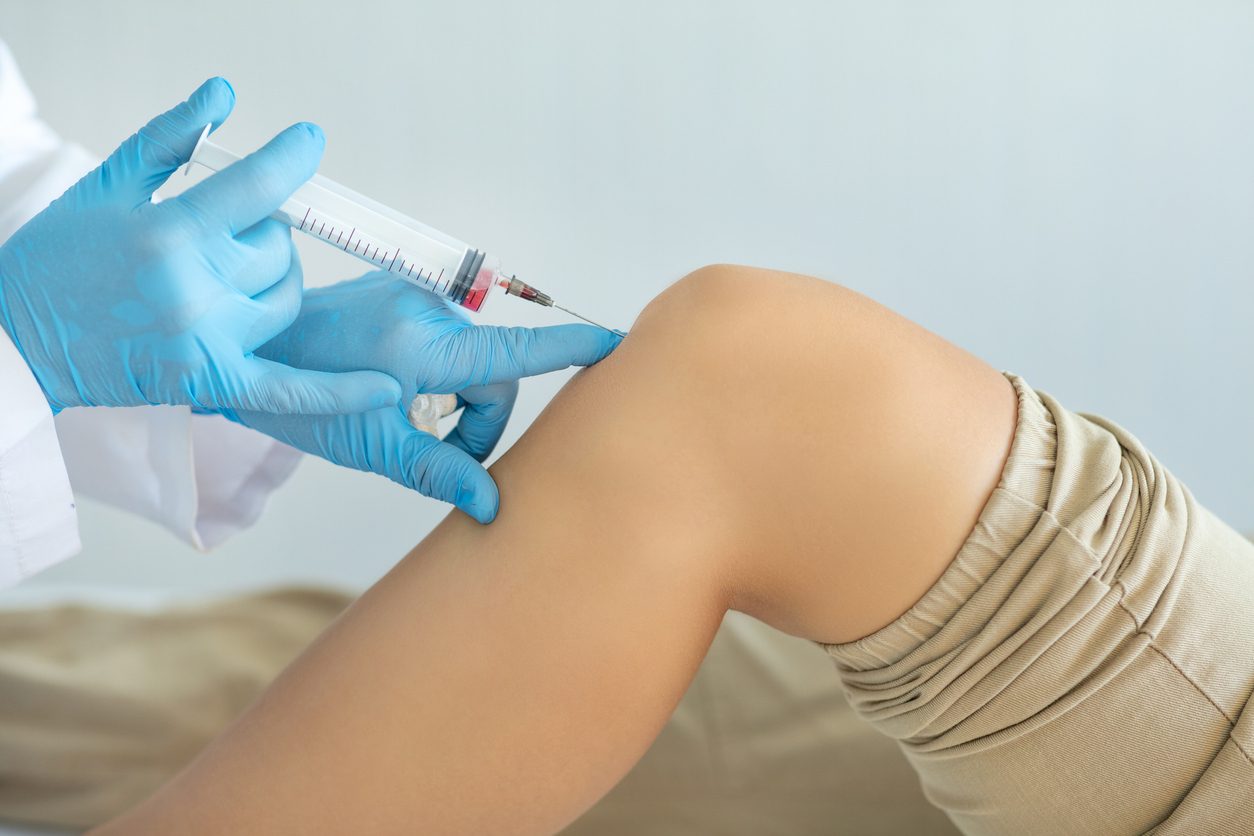 Patient receiving PRP injection to relieve knee pain